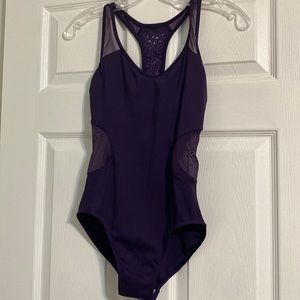 Beautiful purple leotard- lace centers and floral cutouts on back,size adult sm.